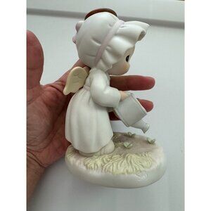 Vintage 1996 Precious Moments "Some plant some water, but God Giveth the increas